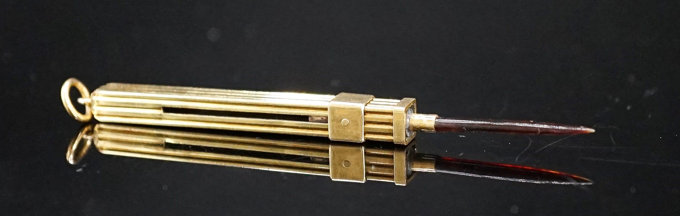 A yellow metal mounted tortoiseshell propelling toothpick, 52mm.